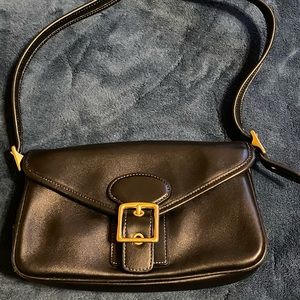 Coach black shoulder bag with gold hardware.